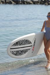 Tallia Storm in Swimsuit - Rides a Paddle Board in Marbella 08/18/2017