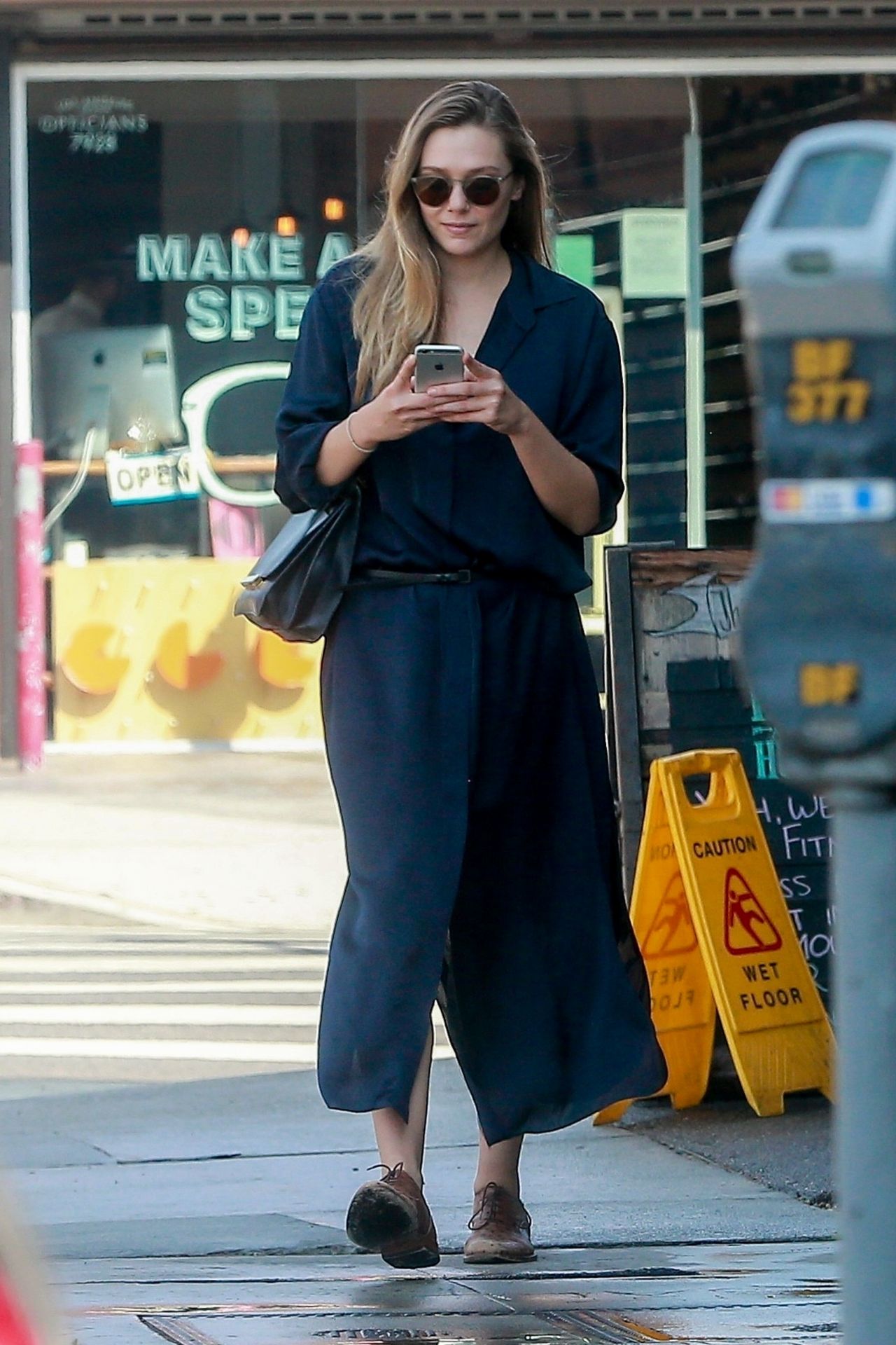 Elizabeth Olsen Checks Messages - West Hollywood 08/29/2017 • CelebMafia