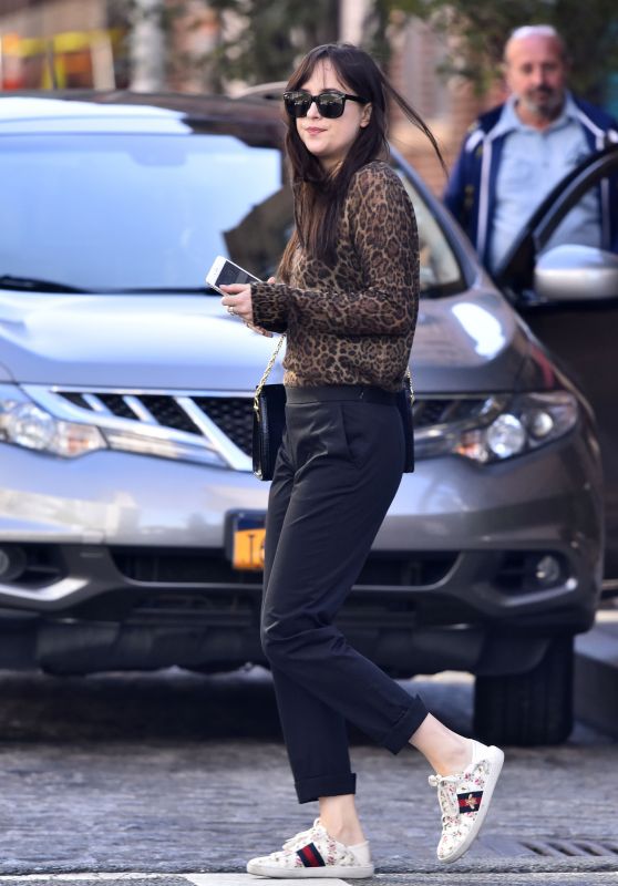 Dakota Johnson in Leopard Top and Gucci White Sneakers and Bag - New York 10/02/2017