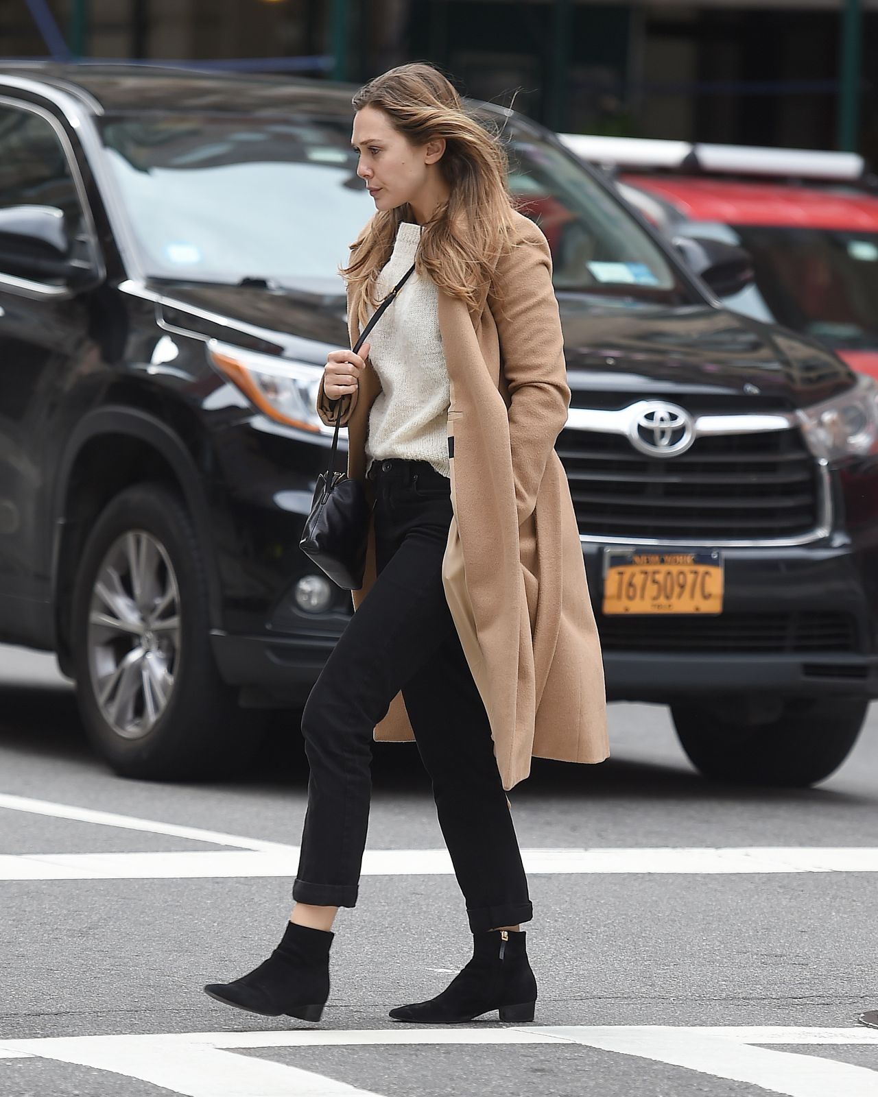 Elizabeth Olsen in a Beige Coat - New York City 10/16/2017 • CelebMafia