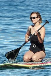 Olivia Wilde in a Black Swimsuit  - Paddle-Boarding in Hawaii 11/26/2017