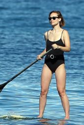 Olivia Wilde in a Black Swimsuit  - Paddle-Boarding in Hawaii 11/26/2017