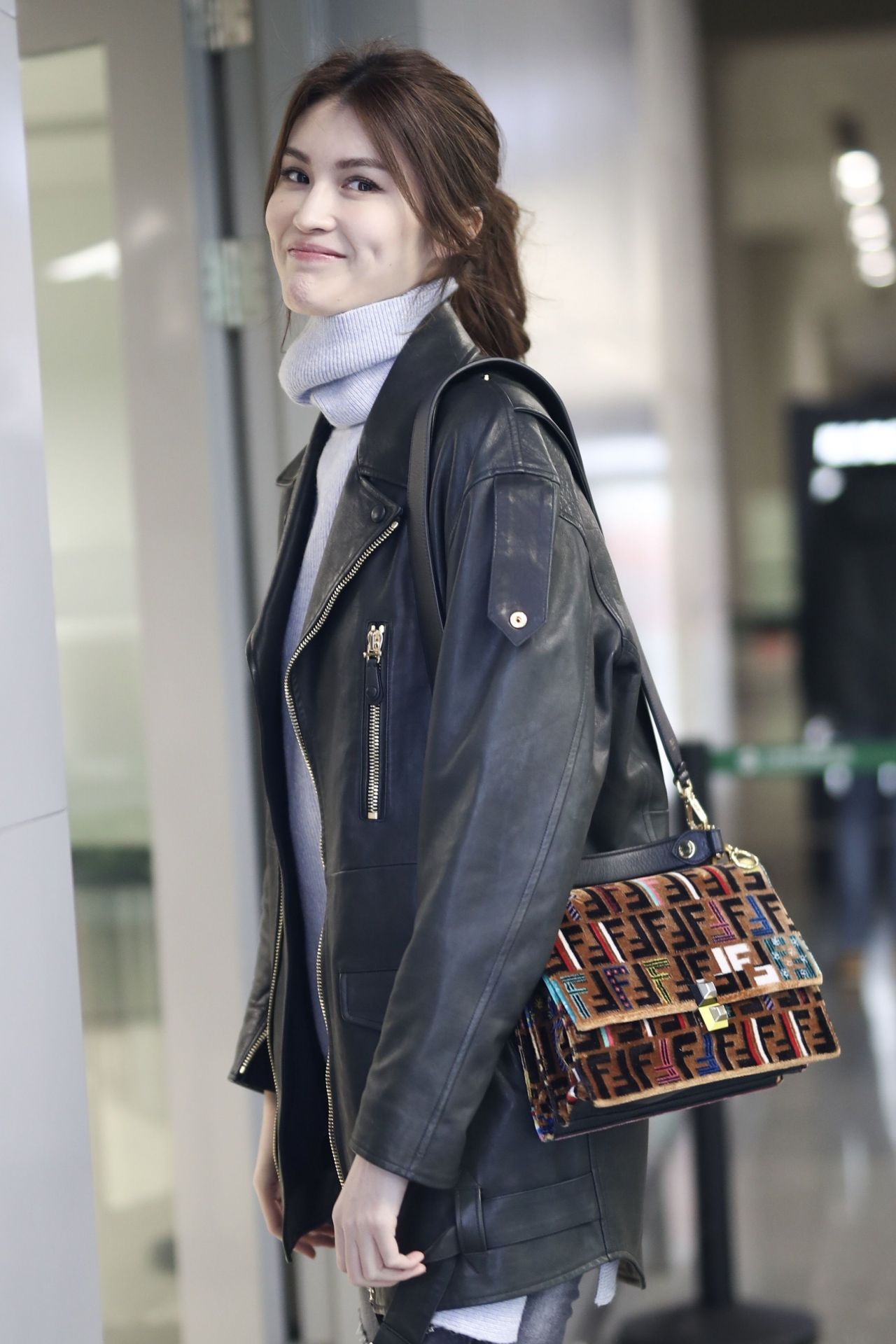 File--In this undated photo, Chinese model He Sui arrives at a Shanghai  airport befoere departure in Shanghai, China. Shoulder bag: Louis Vuitton  (Photo by Wang Jiali/ChinaImages/Sipa USA Stock Photo - Alamy