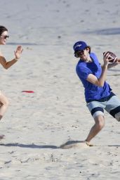 Nancy Shevell Plays American Football on a Beach in Saint-Barthelemy