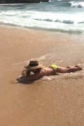 Britney Spears in a Yellow Bikini on the Beach