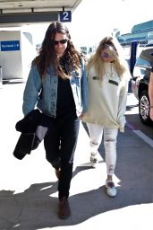 Kesha in a Gucci Hoodie and Brad Ashenfelter at LAX Airport