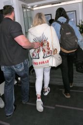 Kesha in a Gucci Hoodie and Brad Ashenfelter at LAX Airport