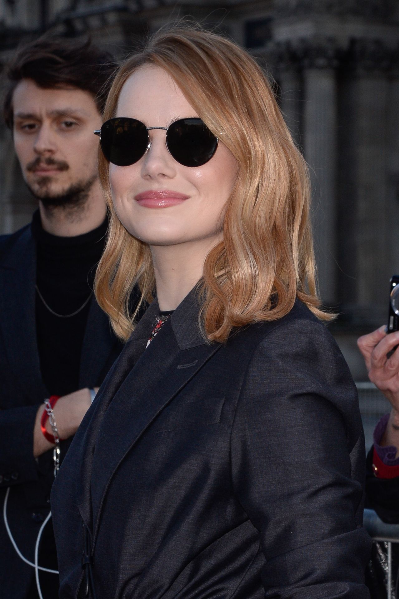 Emma Stone is vacation-ready in chic green top at Louis Vuitton