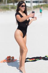 Claudia Romani in a Black Swimsuit on the Beach in Miami 05/28/2018