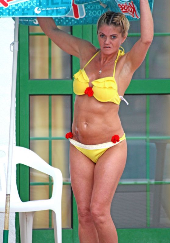 Danniella Westbrook in a Yellow Bikini by the Poolside in Spain 05/28/2018