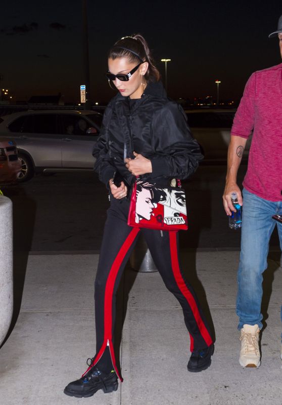 Bella Hadid in Fear Of God Pants with Off White Sunglasses and a Prada Handbag - JFK Airport in New York 06/14/2018