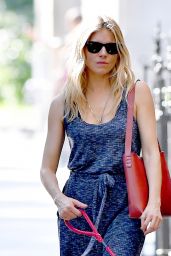 Sienna Miller in a Blue Jumpsuit With a Red Handbag - Walks Her Dog in NYC 06/16/2018