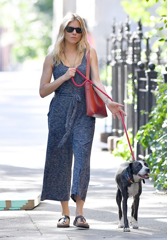Sienna Miller in a Blue Jumpsuit With a Red Handbag - Walks Her Dog in NYC 06/16/2018