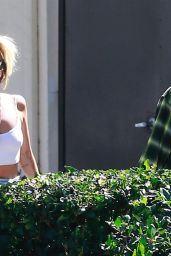 Hailey Baldwin in a White Sports Bra and Black Cropped Leggings in West Hollywood