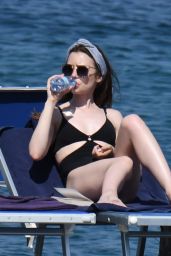 Lily Collins in a Black Swimsuit in Ischia Porto