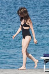 Lily Collins in a Black Swimsuit in Ischia Porto
