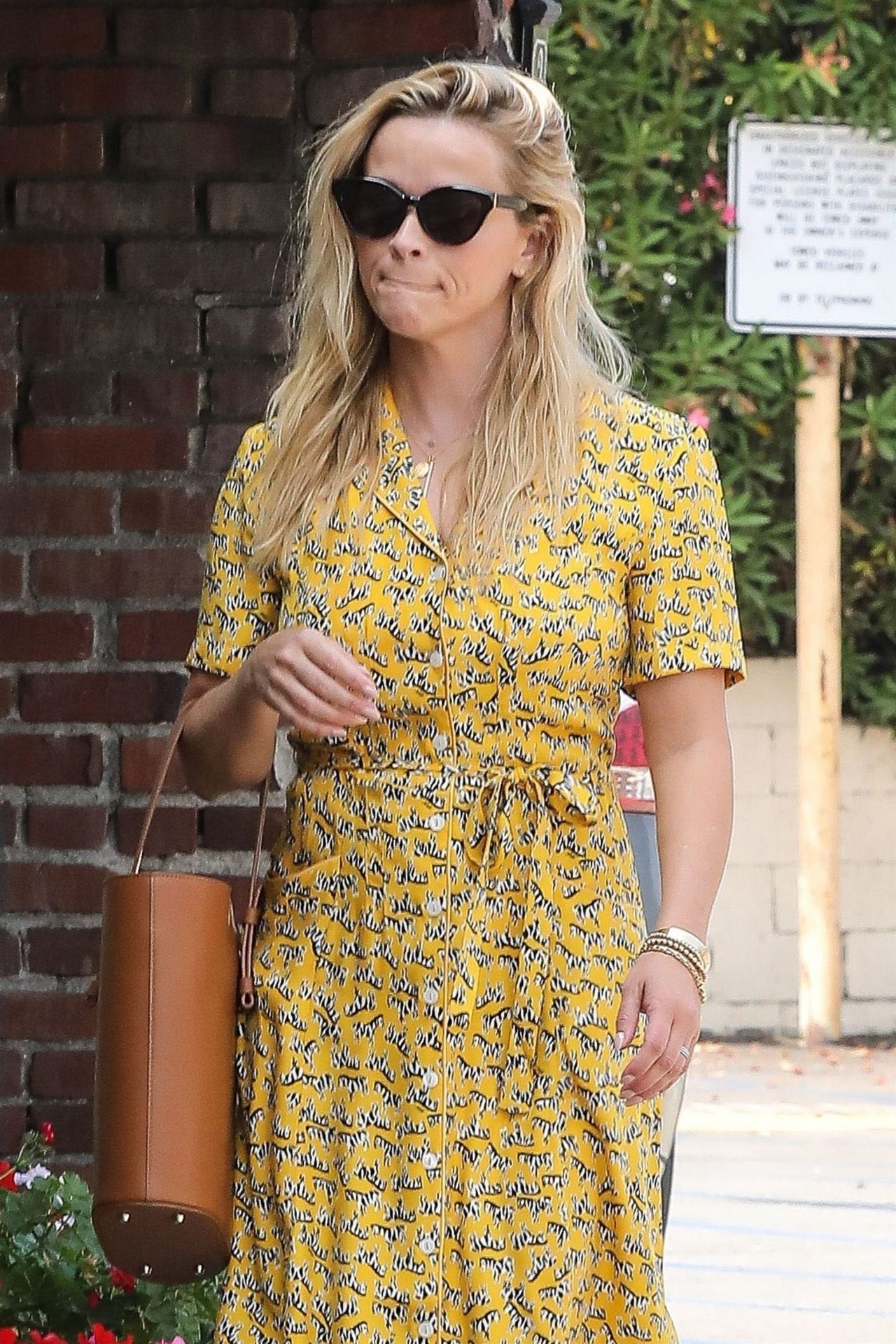 Reese Witherspoon in yellow midi dress in Santa Monica on August 4