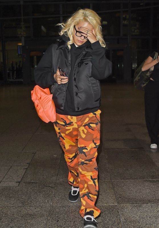Rita Ora in Camo Pants at Heathrow Airport 09/19/2018