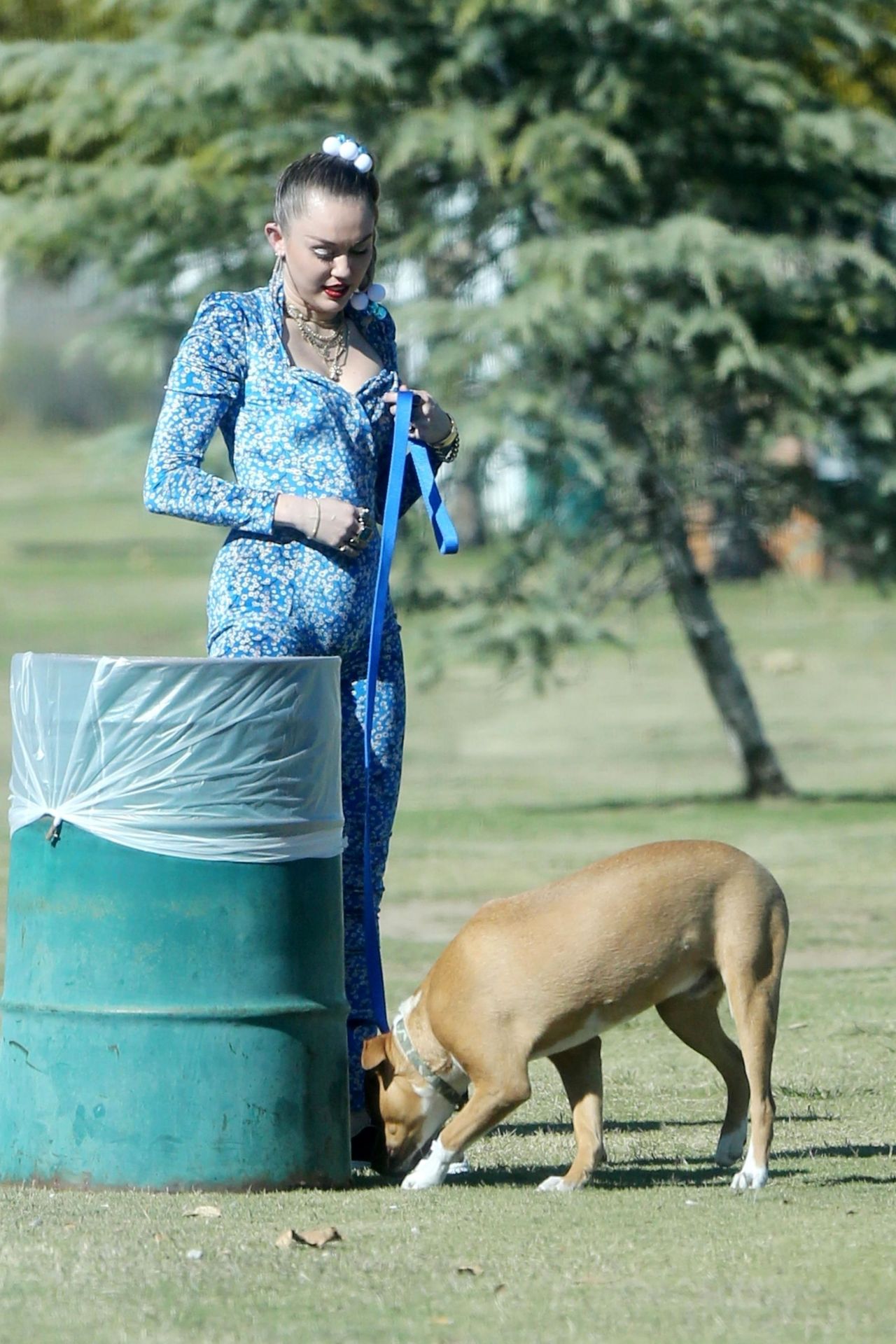 Miley Cyrus in a Blue Floral Jumpsuit On Set of Her Latest Project in