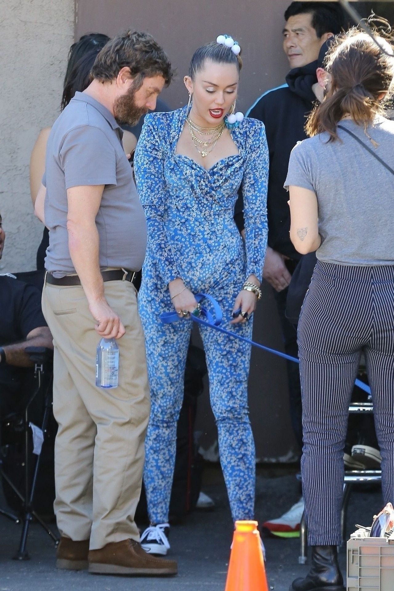 Miley Cyrus in a Blue Floral Jumpsuit On Set of Her Latest Project in