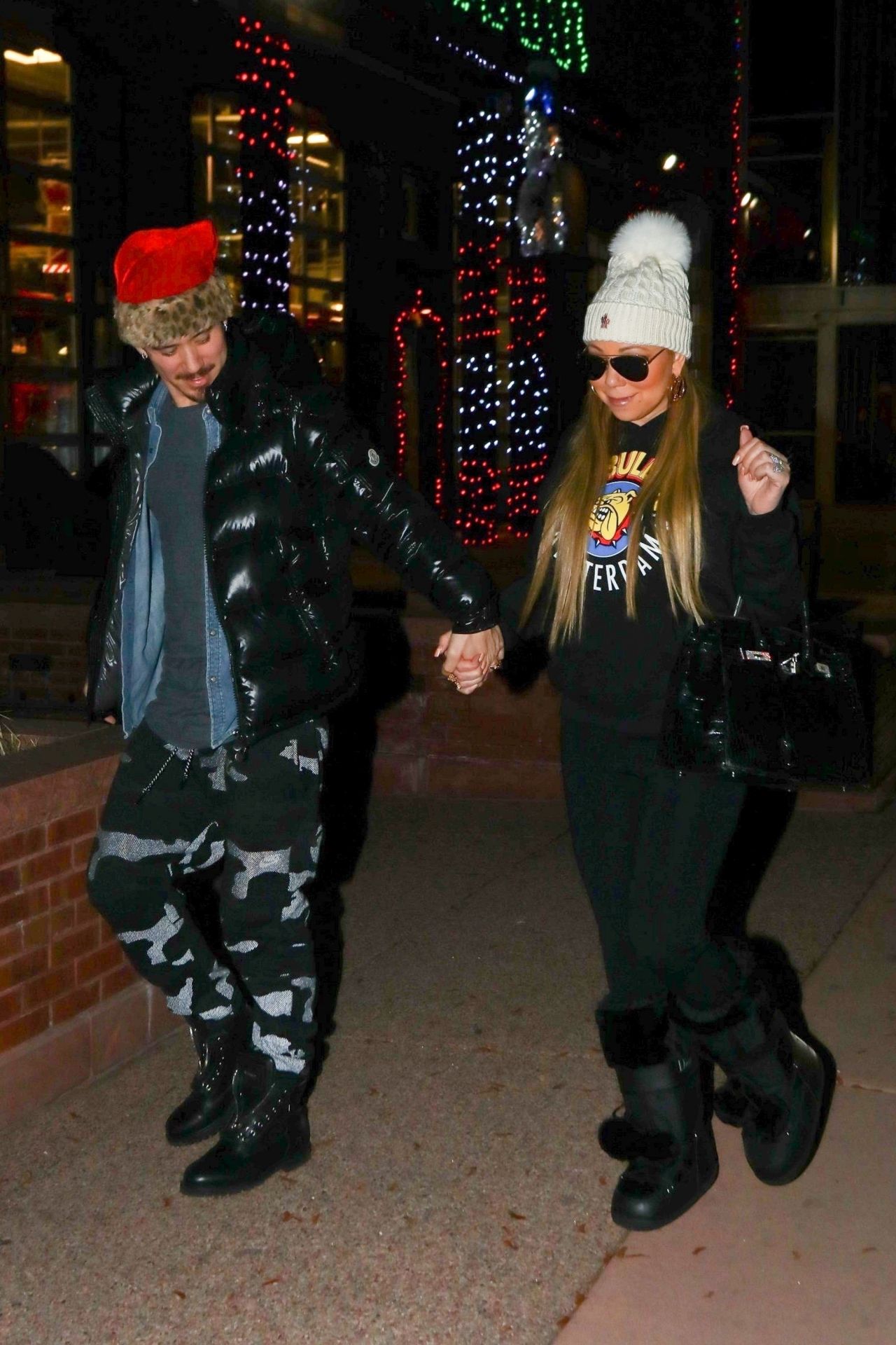 Mariah Carey wears visor shades and drinks champagne on trip to Louis  Vuitton store in Aspen