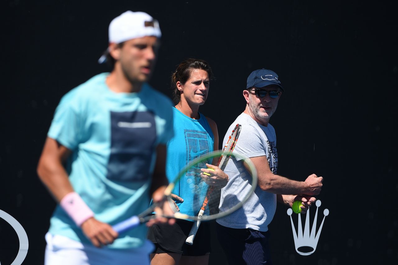 Amelie Mauresmo – Durring Practice of Lucas Pouille in Melbourne 01/13 ...