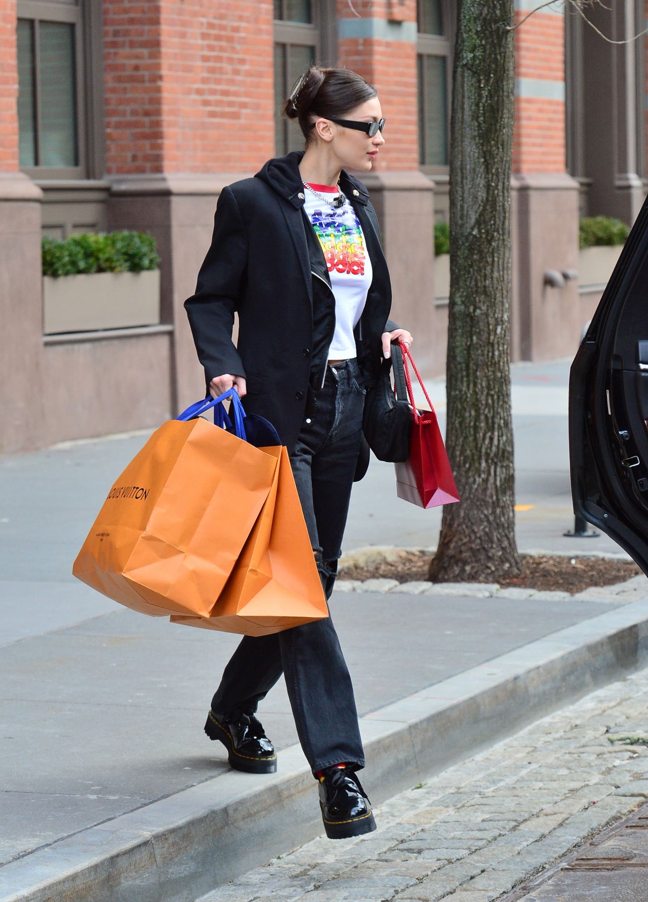 bella hadid carries her louis vuitton and chanel bags as she steps out of  her apartment in new york city-021120_4