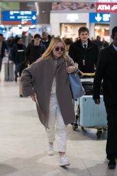 Dakota Fanning in Travel Outfit - Charles-de-Gaulle Airport in Paris 01/21/2019