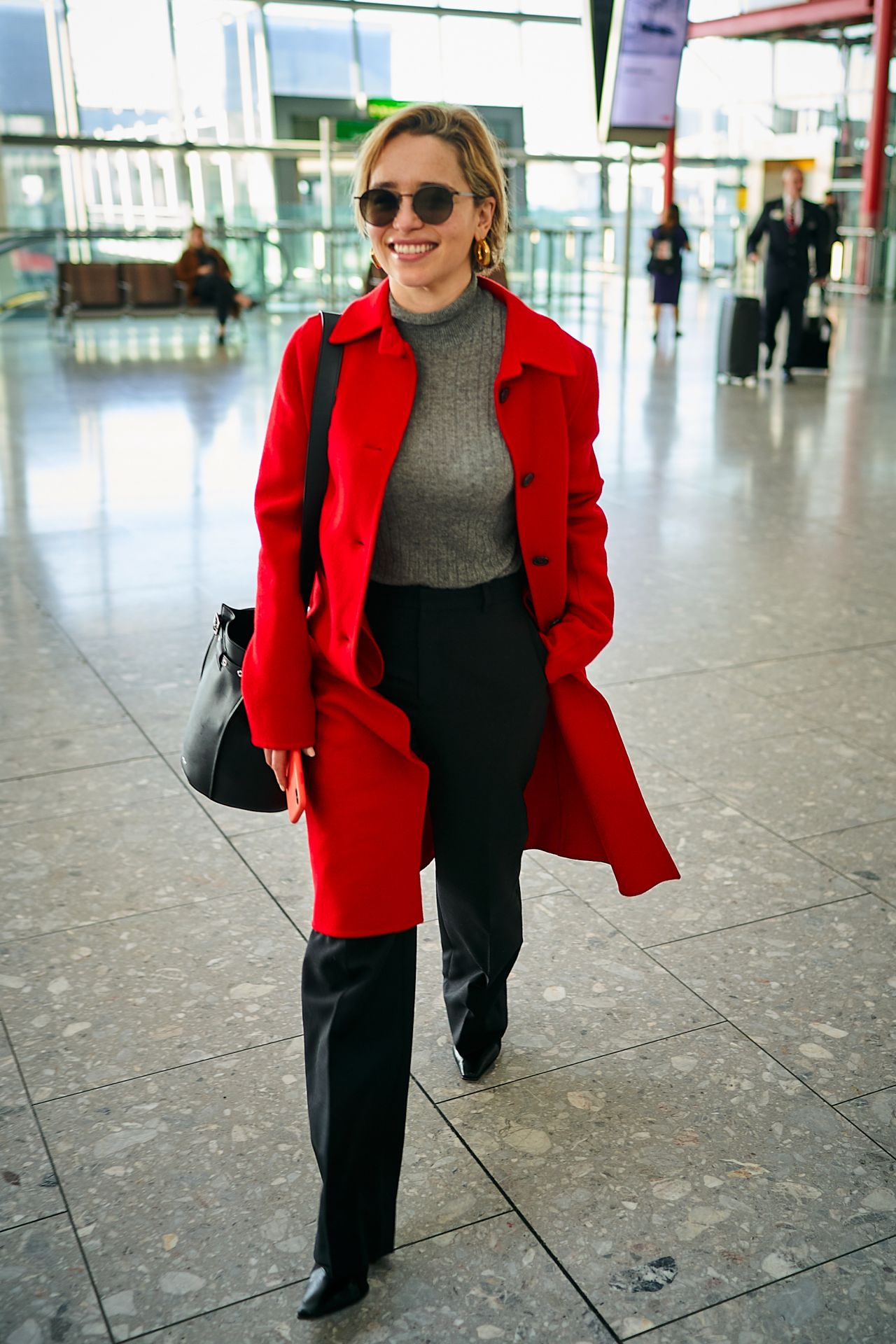 Emilia Clarke in Travel Outfit - Heathrow Airport in London 02/21/2019