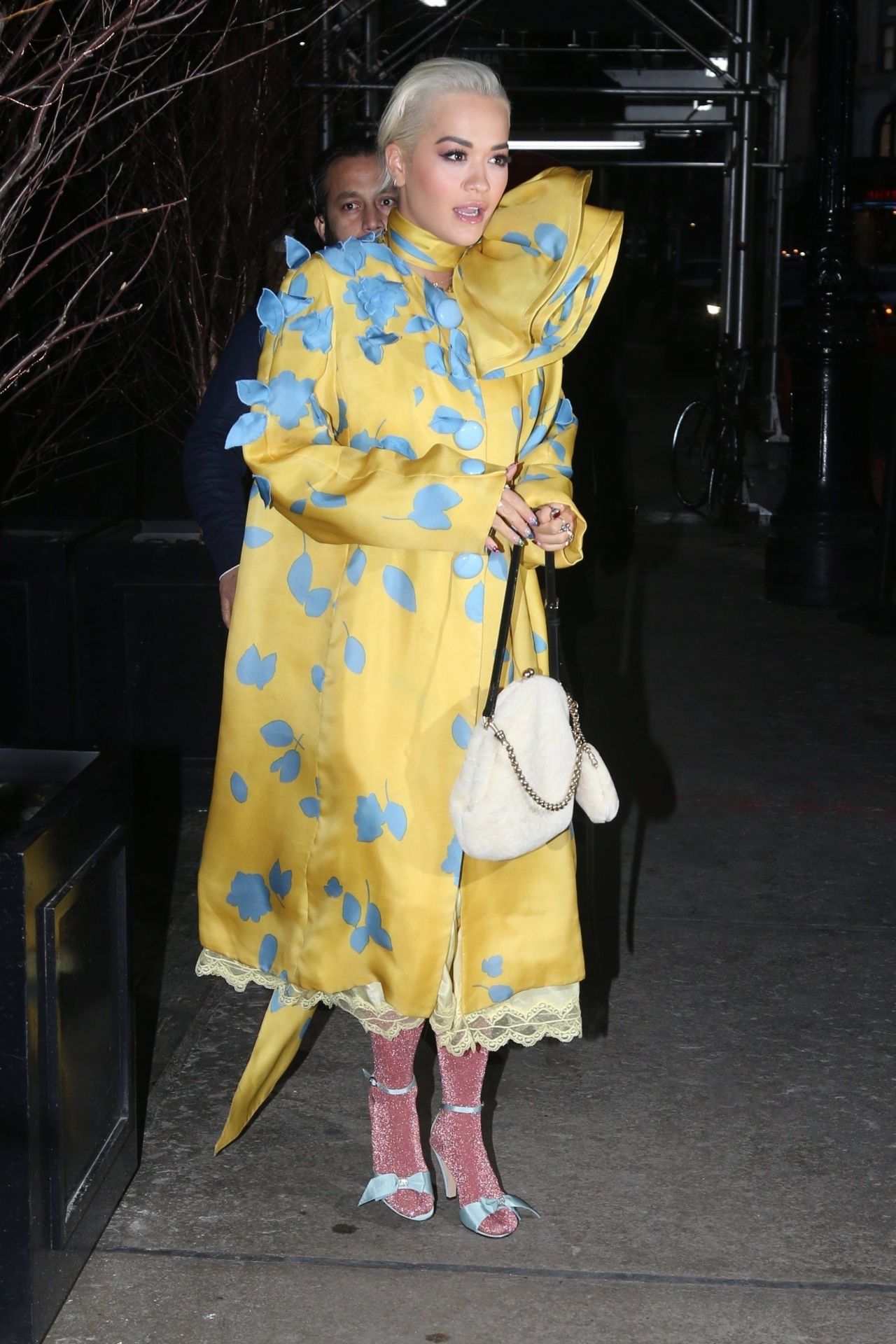 Rita Ora in a Yellow and Blue Dress and Pink Stockings 02/13/2019 ...
