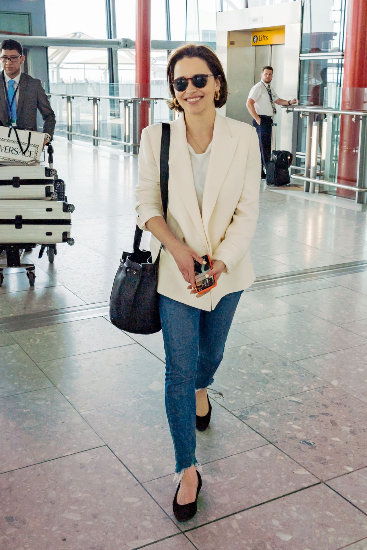 Emilia Clarke in Travel Outfit - Heathrow Airport in London 04/22/2019