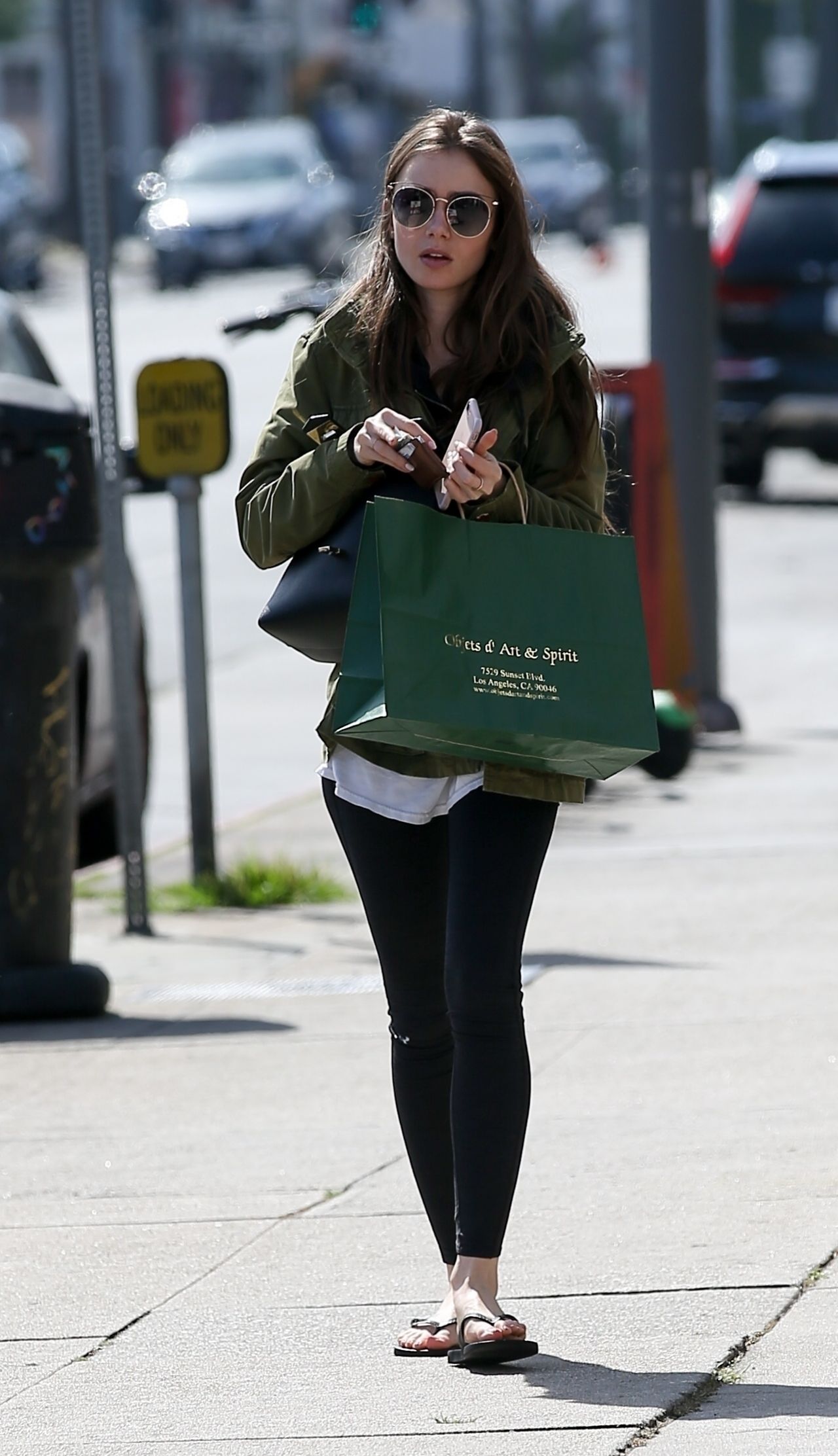 Lily Collins goes shopping at Chanel in Beverly Hills in sky high heels and  baggy trousers Featuring: Lily Collins Where: Los Angeles, California,  United States When: 01 Oct 2015 Stock Photo - Alamy