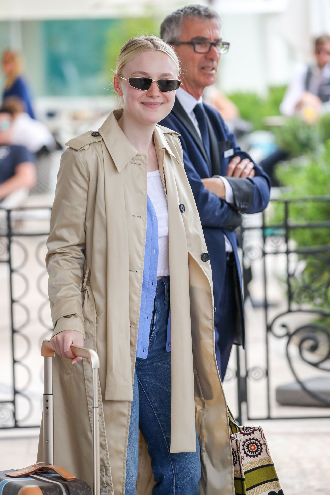 dakota fanning seen with her louis vuitton suitcase outside the martinez  hotel during the 72nd annual cannes film festival in cannes, france-220519_8