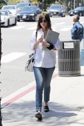 Dakota Johnson - Holds on to Her Mac Book in Beverly Hills 05/29/2019