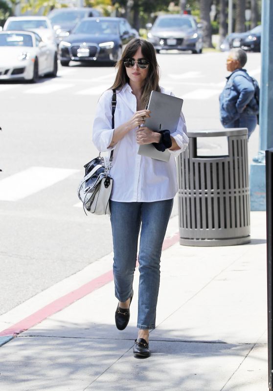 Dakota Johnson - Holds on to Her Mac Book in Beverly Hills 05/29/2019