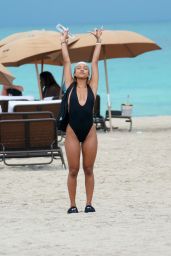 Karrueche Tran in a Black Swimsuit at the Beach in Miami Beach 05/13/2019