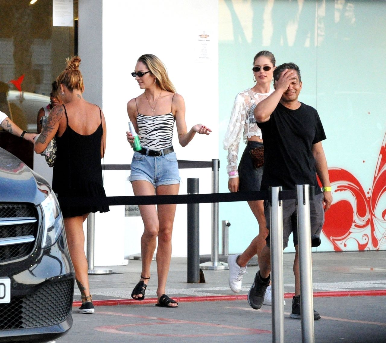 Doutzen Kroes and Candice Swanepoel - Leaving Ushuaia Hotel in Ibiza