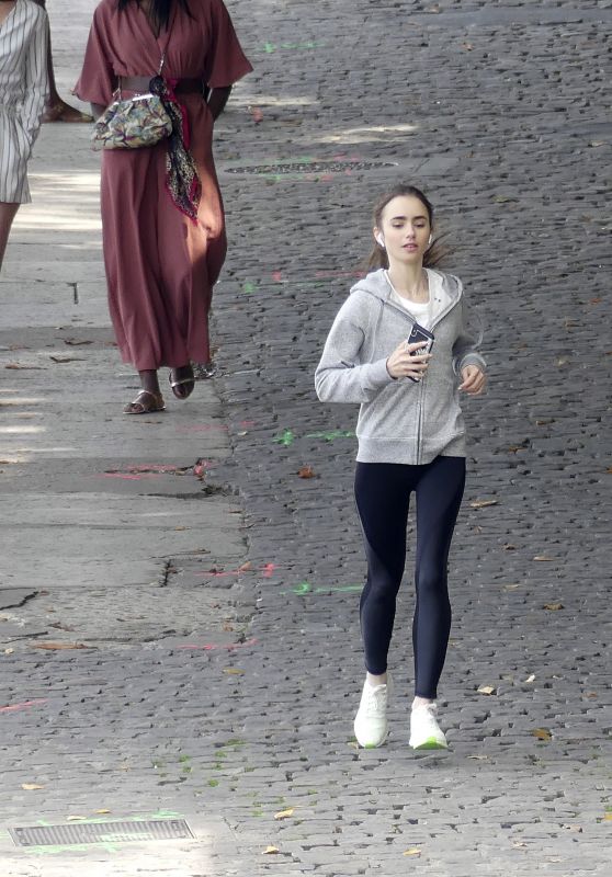 Lily Collins - Filming "Emily in Paris" 08/19/2019