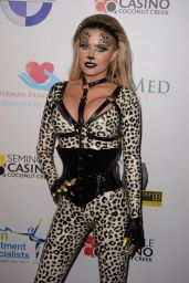 Carmen Electra in Skintight Catsuit and Dramatic Animal Print 10/17/2019