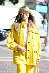 Heidi Klum in a Yellow Jacket and Elastic-Waist Pants 10/18/2019