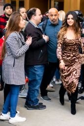 Selena Gomez in a Patterned Dress and Coach Bag 10/28/2019