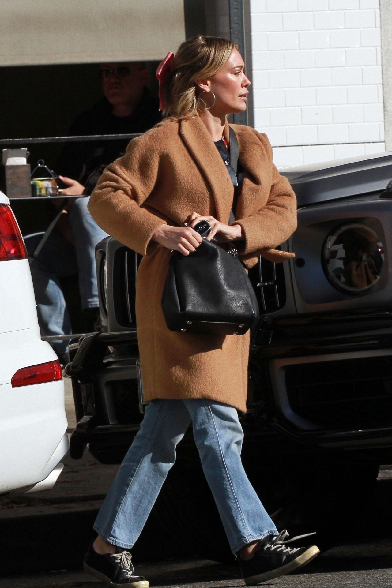 Louis Vuitton Babylone Mahina Bag worn by Hilary Duff Studio City
