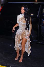 Kim Kardashian in a Gold Velvet Gown 12/23/2019
