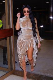 Kim Kardashian in a Gold Velvet Gown 12/23/2019
