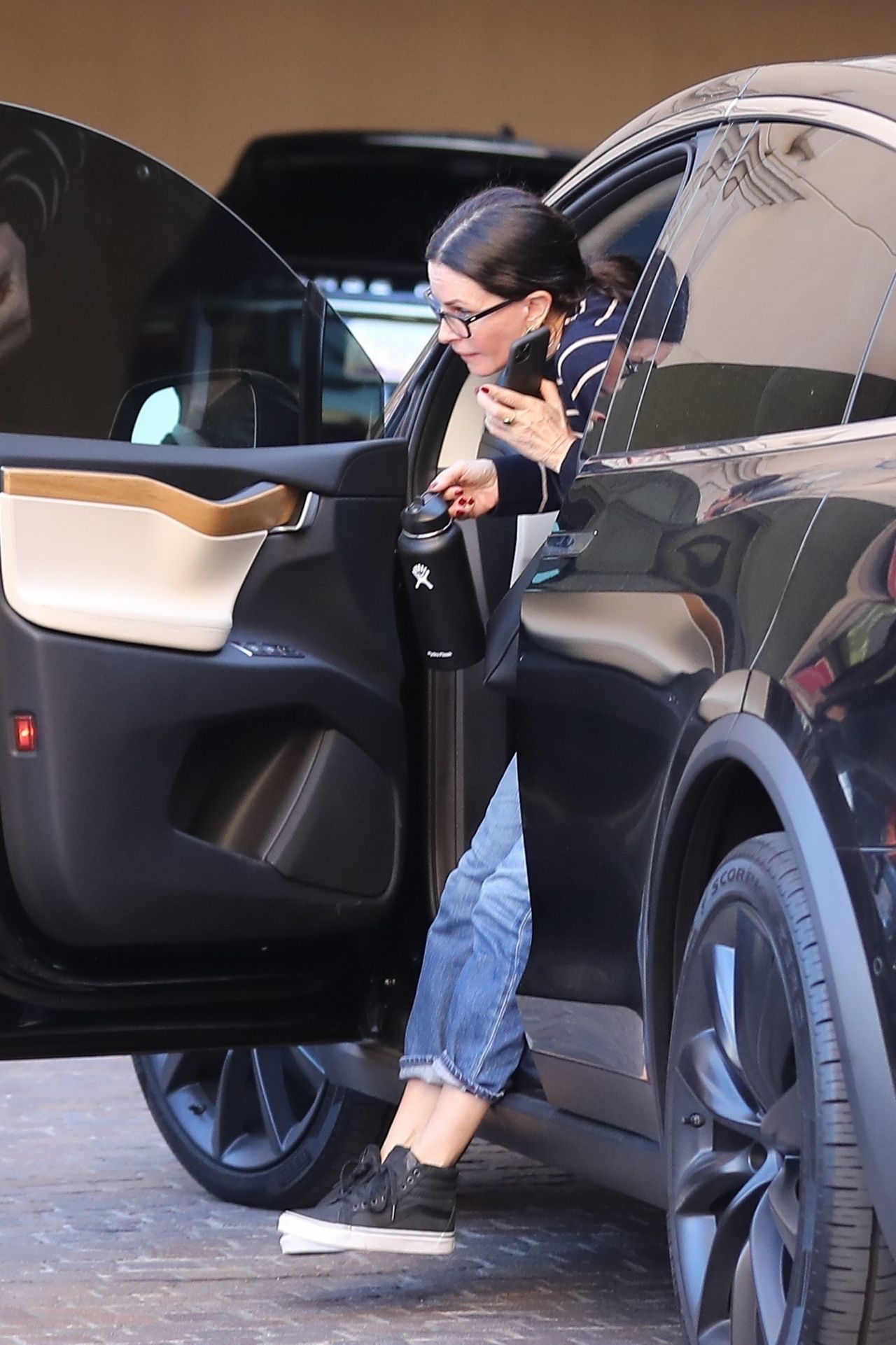 Courteney Cox in Casual Outfit - Arriving at the Montage Hotel in