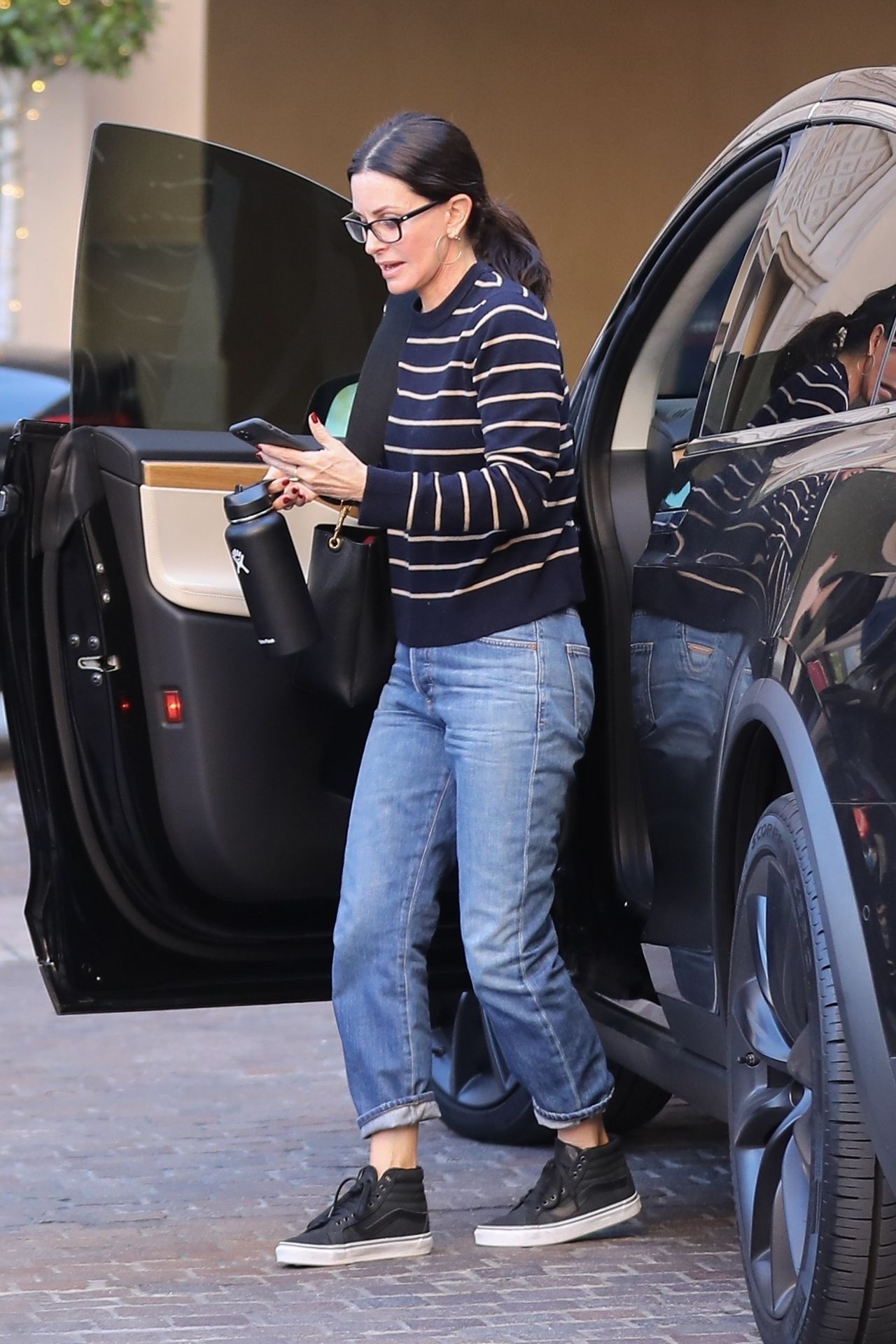 Courteney Cox in Casual Outfit - Arriving at the Montage Hotel in