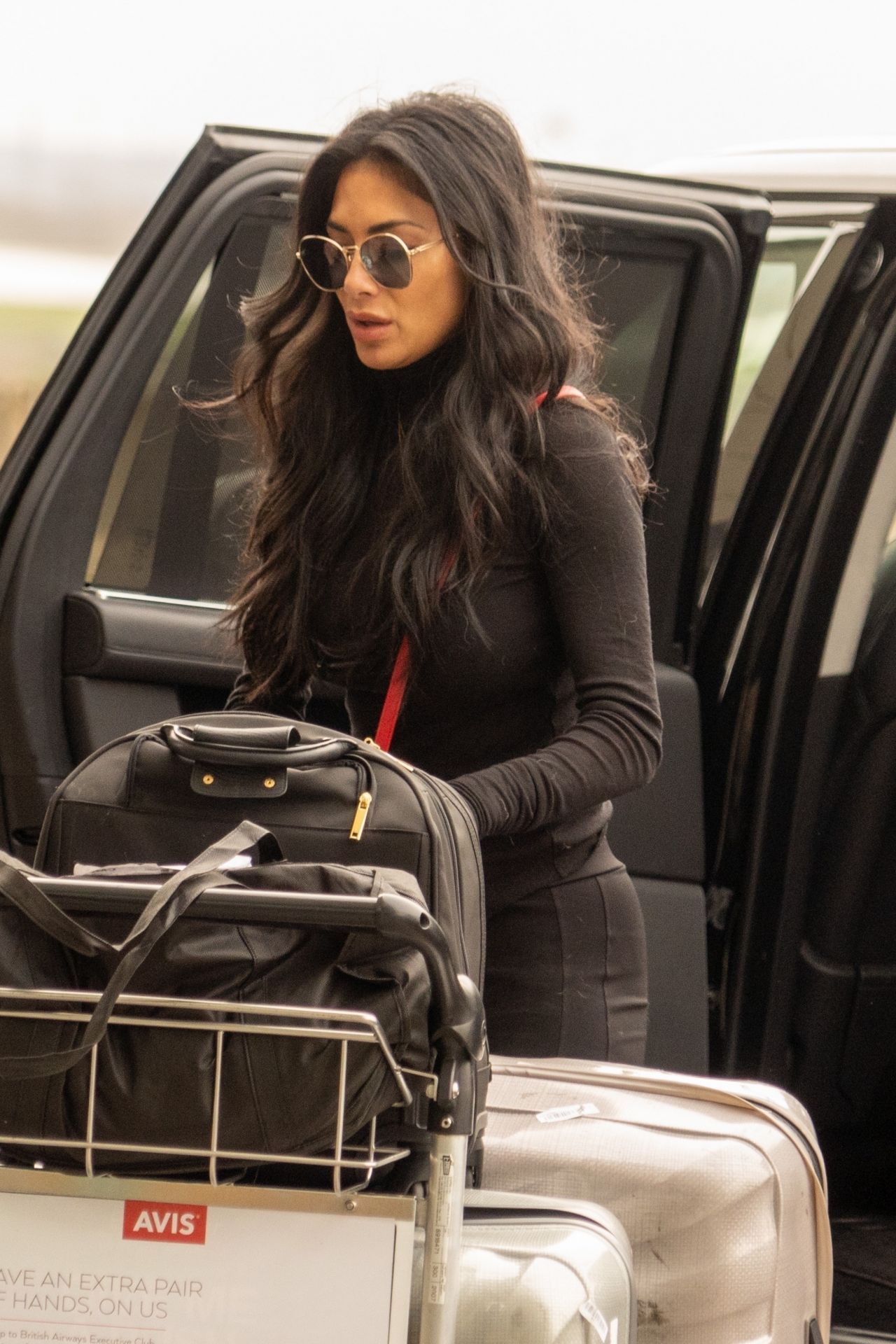 Nicole Scherzinger in Travel Outfit - Heathrow Airport in London 02/03