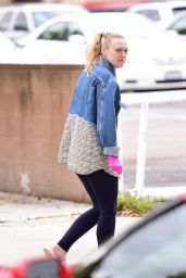 Dakota Fanning Wears Pink Latex Gloves Amid Coronavirus Outbreak in LA 03/16/2020