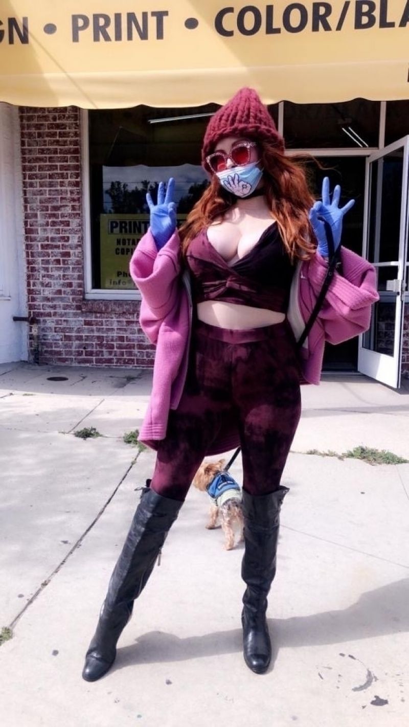 Phoebe Price in a Purple Ensemble With a Surgical Mask and Gloves 03/24/2020