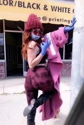 Phoebe Price in a Purple Ensemble With a Surgical Mask and Gloves 03/24/2020